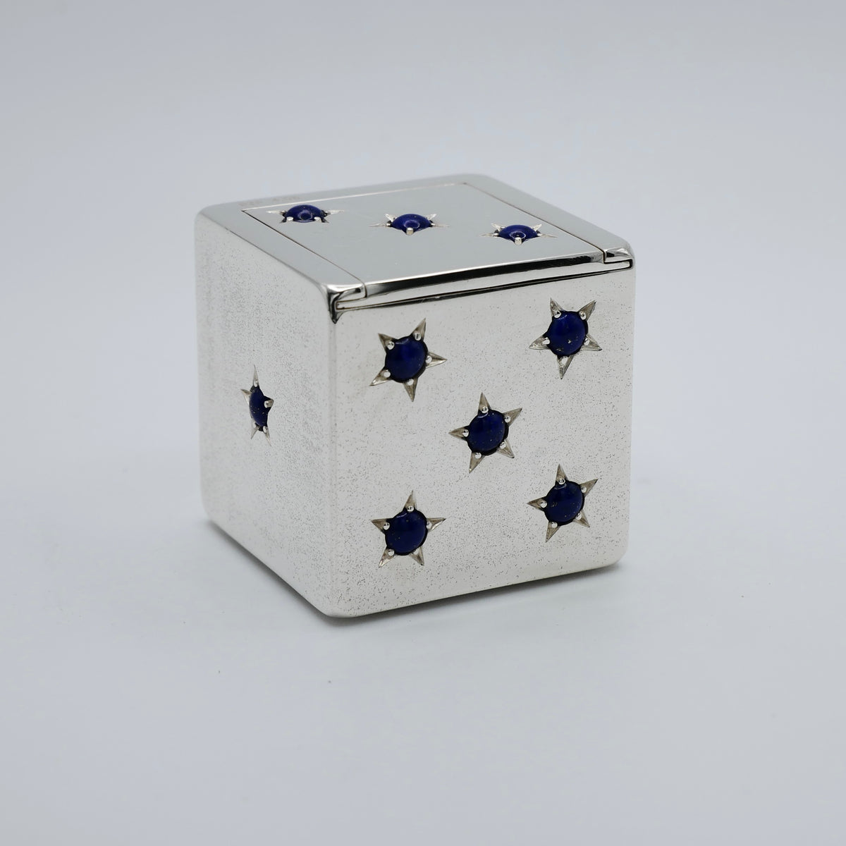 Silver dice trinket box with sliding lid open, showing the gilt interior