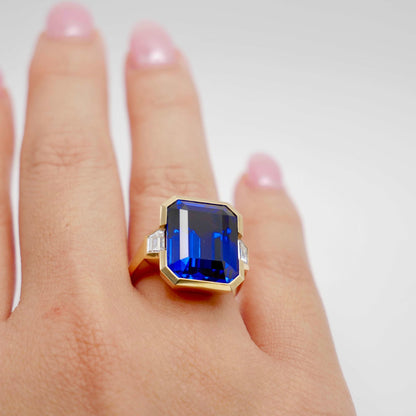 Lab Grown Emerald Cut Sapphire with Trapezoid Diamonds Gold Bezel Three Stone Ring, 18K Gold, view 7