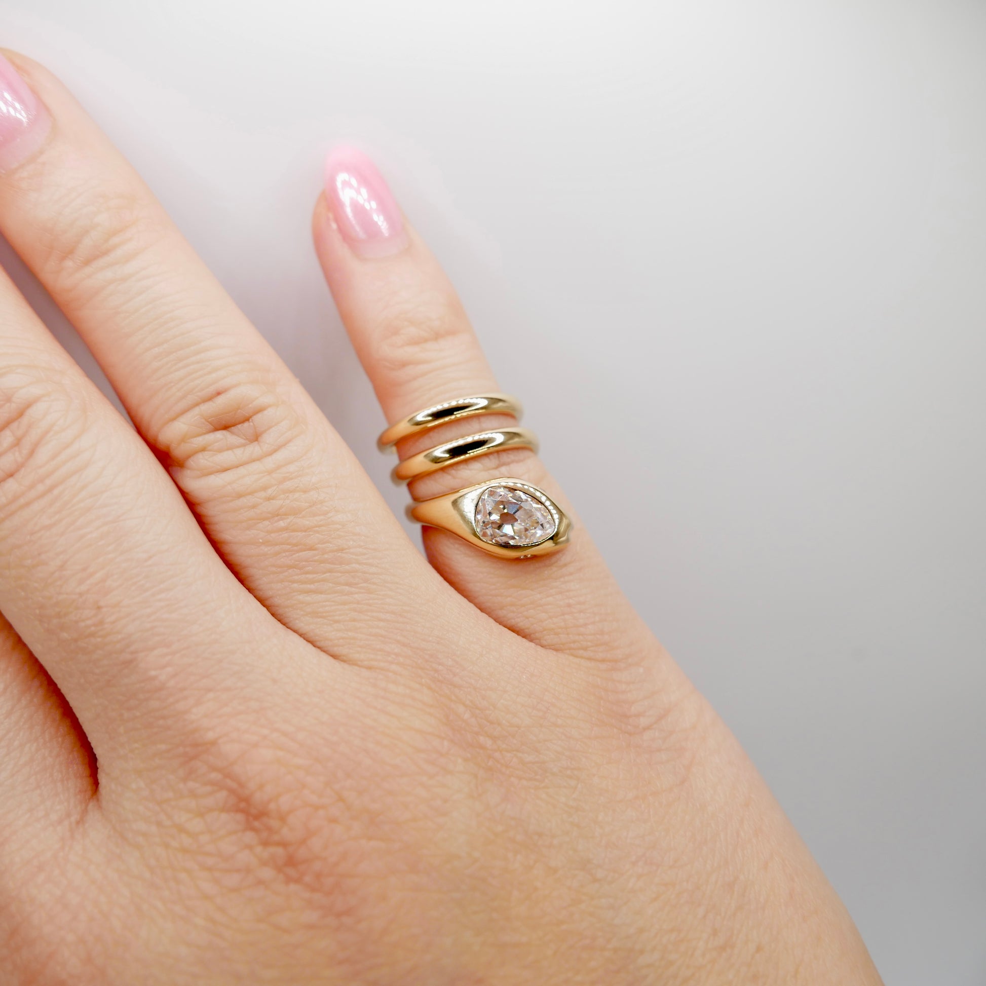 18K Yellow Gold Serpent Coil Ring with Old Mine Cut Pear Shaped Moissanite | by Disco Marshmallow | Arielle Ratner style | Tania Sarin jewelry | serpent ring | sculptural jewelry