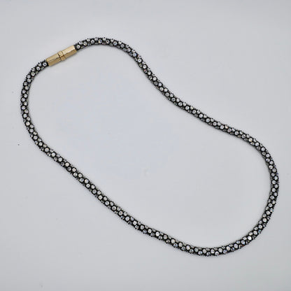 16.75 inch pavé rope necklace, 4 mm wide, blackened silver settings with an 18K gold clasp
