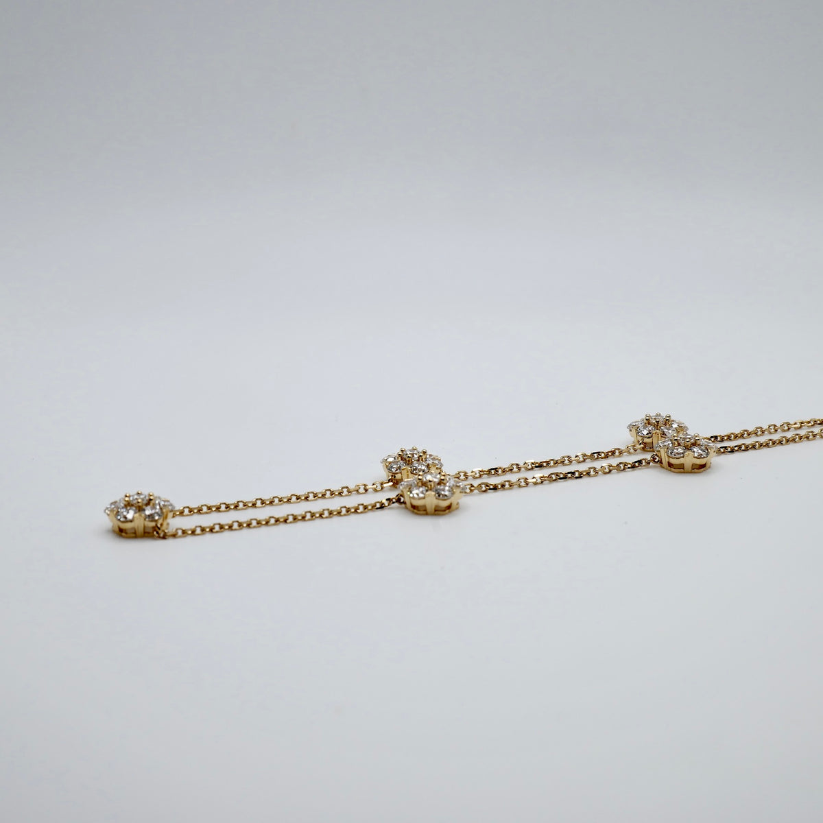 Five lab grown diamond flowers, 3.7 ct total, on a 16.5 inch 18K gold necklace