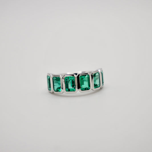 Half Eternity Lab Grown Emerald Cut Emerald Ring in Platinum Bezel Setting, view 2