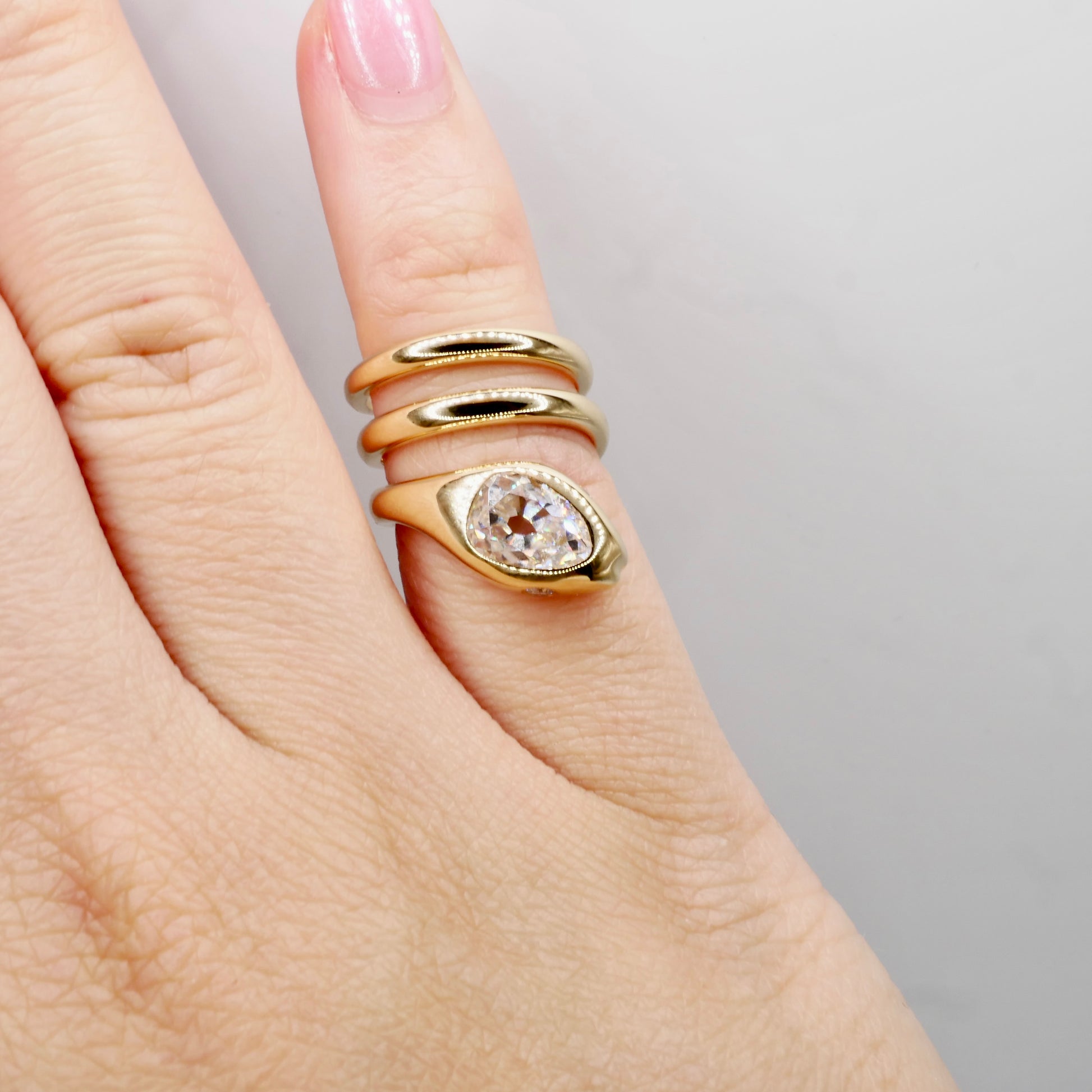 18K Yellow Gold Serpent Coil Ring with Old Mine Cut Pear Shaped Moissanite | by Disco Marshmallow | Arielle Ratner style | Tania Sarin jewelry | serpent ring | sculptural jewelry
