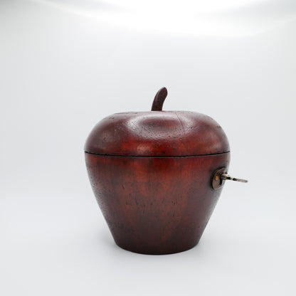 Georgian apple tea caddy in fruitwood showing the oval escutcheon and working lock with key
