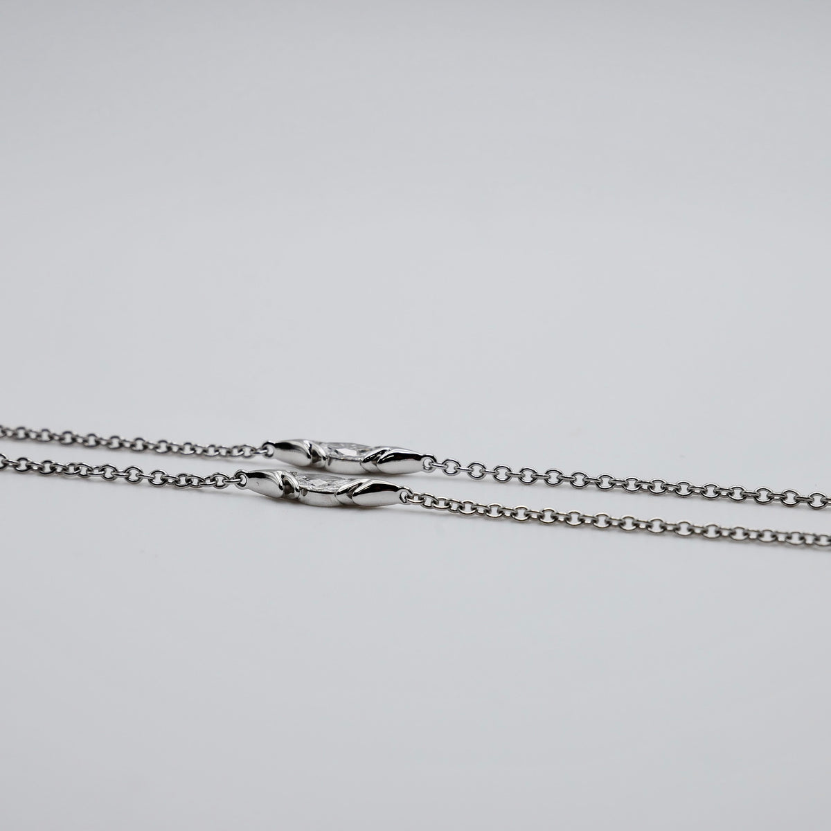 Crested bird pendant necklace in platinum and 18K yellow gold, pavé set with moissanites