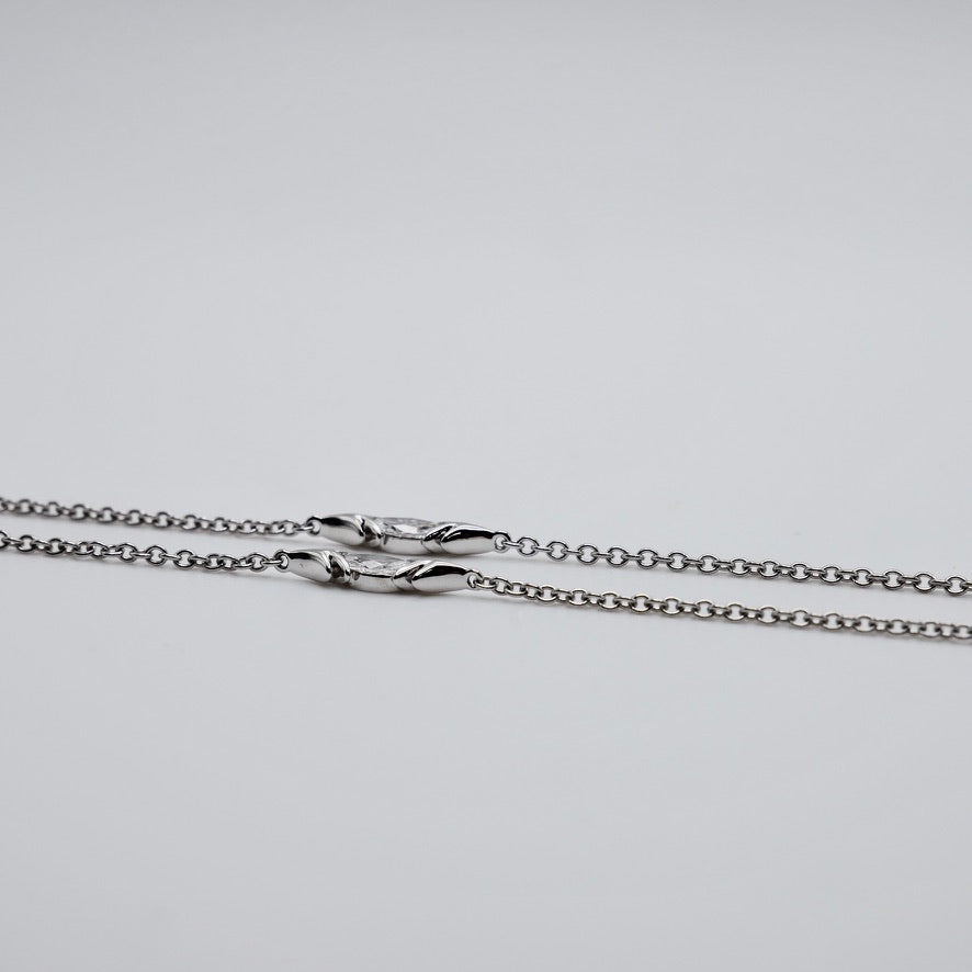 Crested bird pendant necklace in platinum and 18K yellow gold, pavé set with moissanites