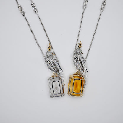 Bird necklace in platinum and 18K gold with a pavé moissanite bird and a gold crest