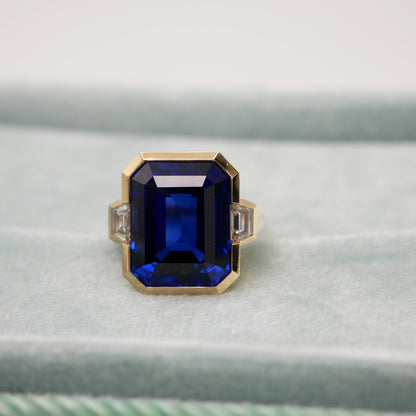 Lab Grown Emerald Cut Sapphire with Trapezoid Diamonds Gold Bezel Three Stone Ring, 18K Gold, view 2