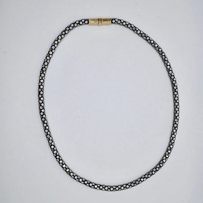 Pavé rope tennis necklace in oxidised sterling silver, set all the way around with moissanite or lab-grown diamonds, with an 18K yellow gold box clasp
