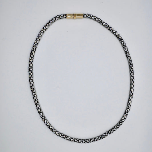 Pavé rope tennis necklace in oxidised sterling silver, set all the way around with moissanite or lab-grown diamonds, with an 18K yellow gold box clasp