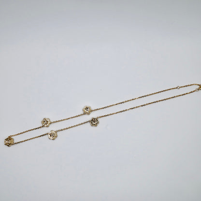 Back of the lab diamond flower necklace showing the 18K yellow gold flower settings and clasp