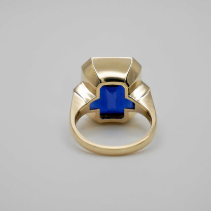 Lab Grown Emerald Cut Sapphire with Trapezoid Diamonds Gold Bezel Three Stone Ring, 18K Gold, view 5