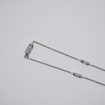 Handcrafted bird pendant necklace in solid 18K gold and platinum on a white gold chain