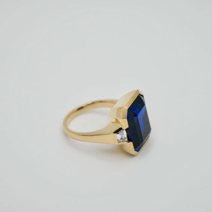 Lab Grown Emerald Cut Sapphire with Trapezoid Diamonds Gold Bezel Three Stone Ring, 18K Gold, view 3