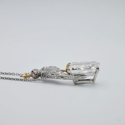 18 carat radiant cut lab grown diamond pendant with a gold crested bird in platinum and 18K gold