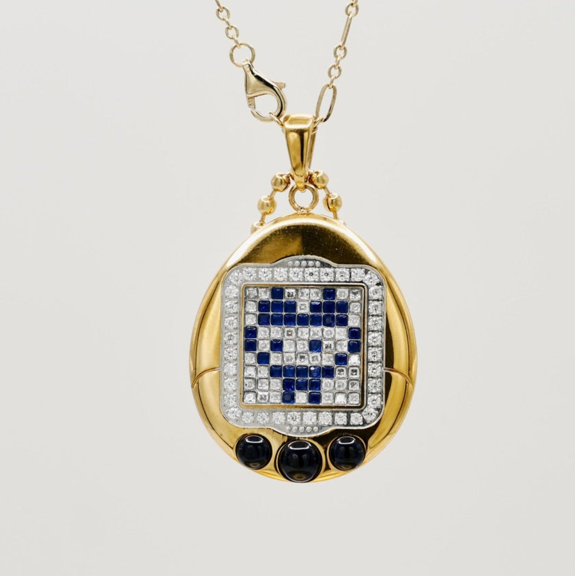 Tamagotchi pendant with emeralds, sapphires, rubies and diamonds
