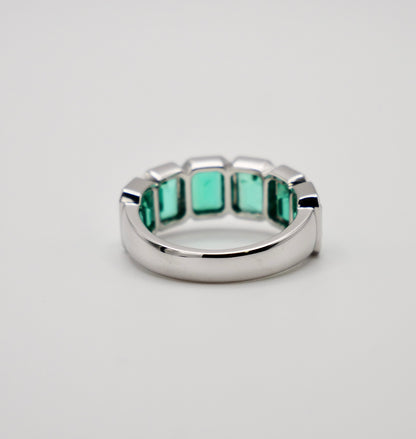 Half Eternity Lab Grown Emerald Cut Emerald Ring in Platinum Bezel Setting, view 7