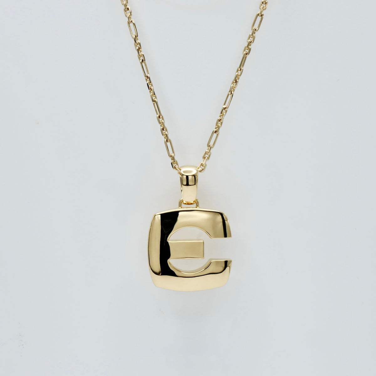 Chunky block initial pendant in solid yellow gold, 38 mm, with a domed high-polish finish and heavy bale