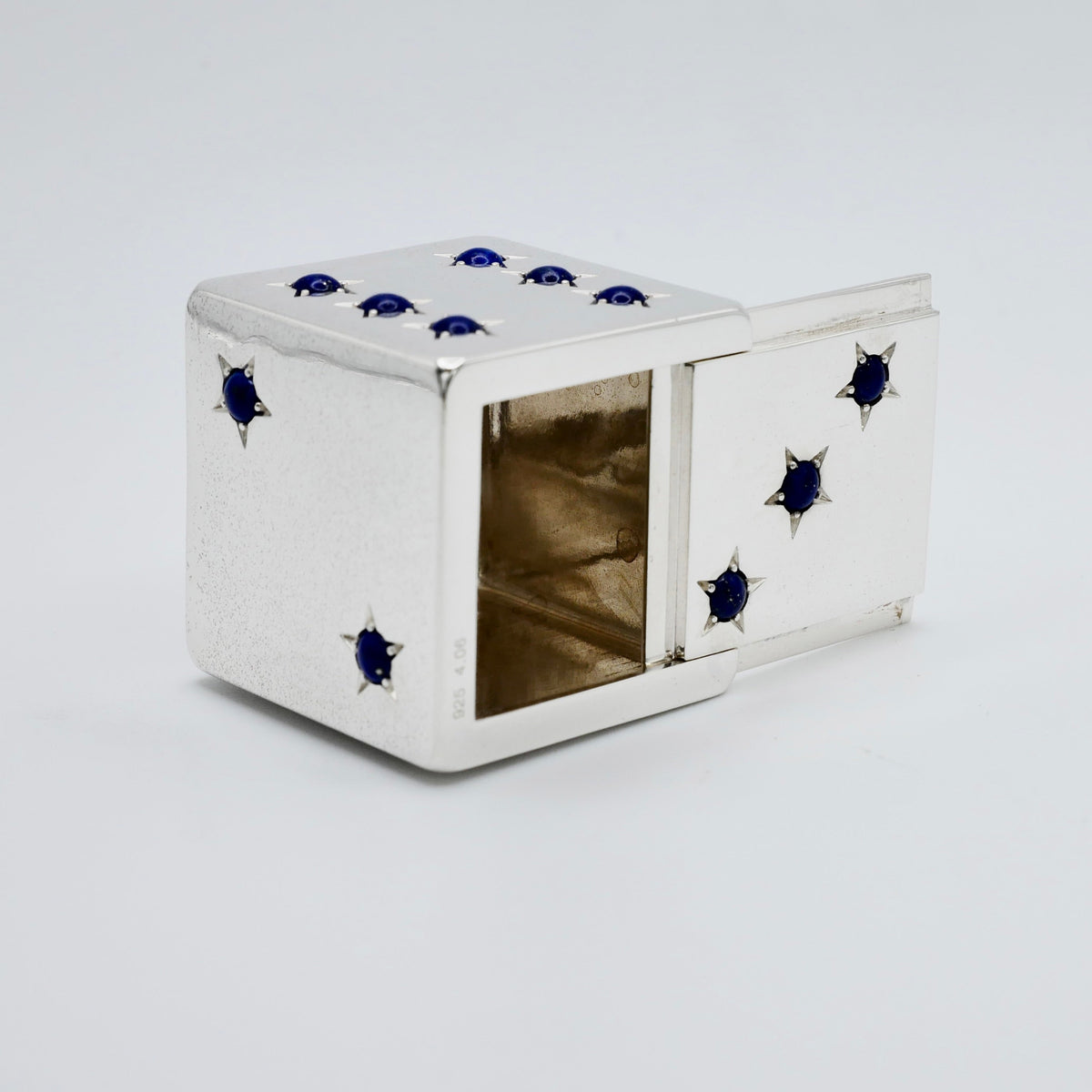 Sterling silver dice pill box with lapis lazuli cabochon pips, each set in a six-pointed star