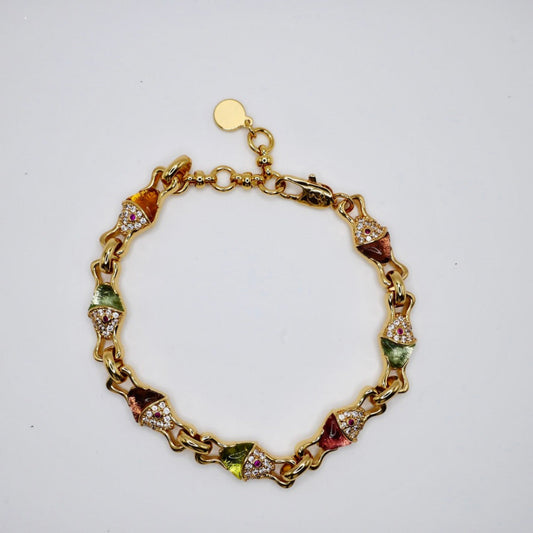 Gold bracelet with colorful gemstones on a white background