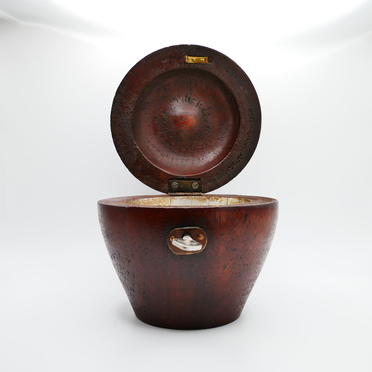 Fruitwood apple tea caddy opened, showing the original hand-laid foil lining to the interior